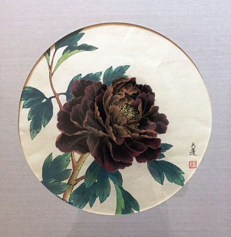 Dark red peony blossom with branch and flower